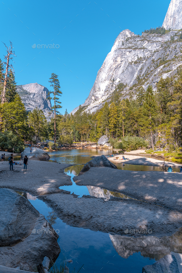 Mirror lake and its beautiful reflections in the water Stock Photo by